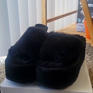Fuzzy black platform sandles from Dollskill